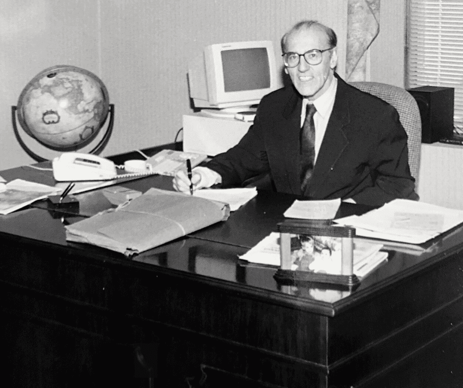 Alfred Gemma, founder of Gemma Law Associates in Providence Rhode Island, sitting at his desk.