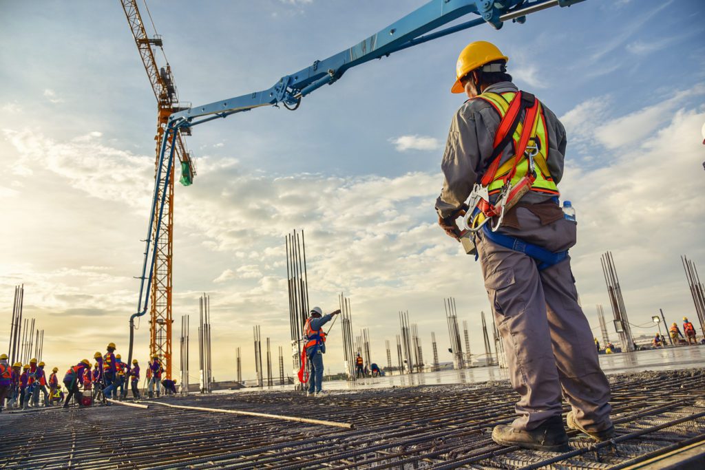 construction worker supervising rebar installment