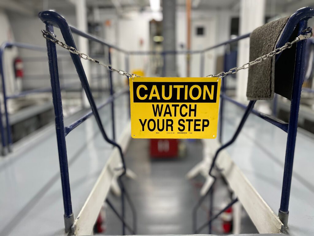 caution sign before industrial stairs