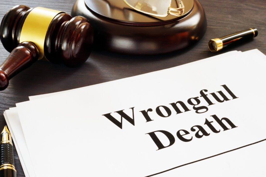 wrongful death written on a paper with a judges gavel next to it