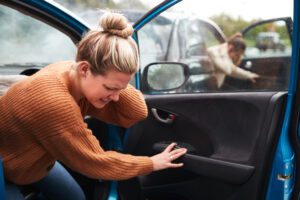 woman getting out of the car after a rhode island car accident
