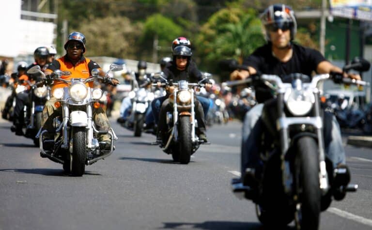 Group of motorcyclists riding together while wondering if they can sue if they were injured at Laconia bike week.