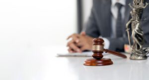 A truck accident lawyer sitting at their desk with a gavel in the foreground. What does a truck accident lawyer do?