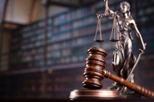 A gavel and the scales of justice. How much do most Providence personal injury cases settle for?