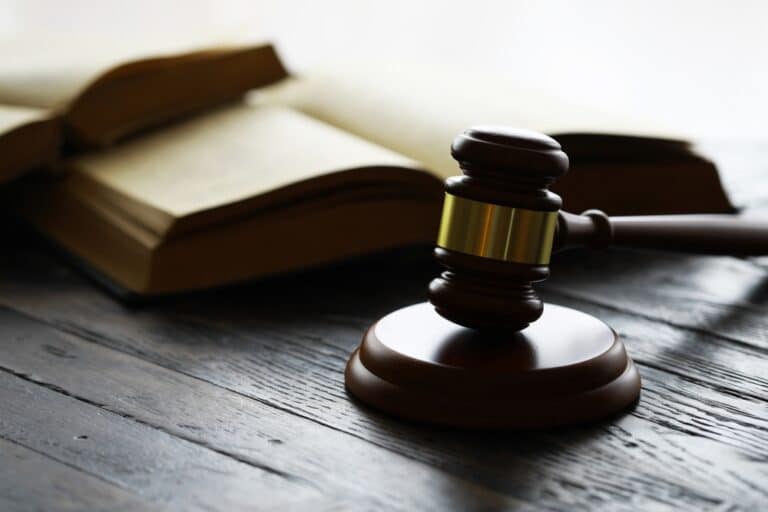 A gavel sitting next to legal books. How long do most Providence personal injury cases take to settle?