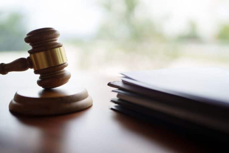A gavel sitting next to a stack of papers. What are the odds of winning a personal injury lawsuit in Providence?