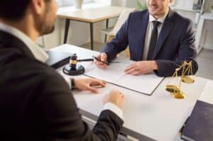 Client reviewing a contingency fee agreement with a personal injury lawyer