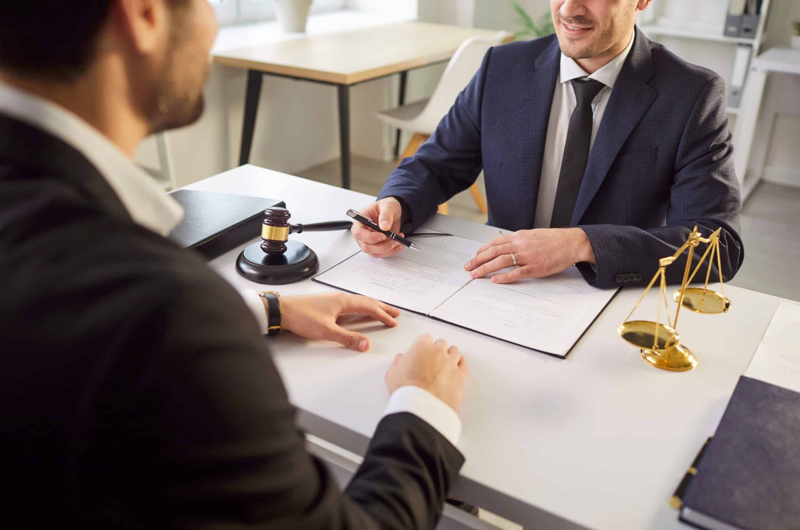 Client reviewing a contingency fee agreement with a personal injury lawyer